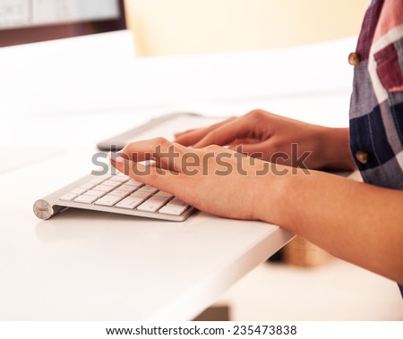 Attractive female working at home.Blogging.Only hands are  visibly.