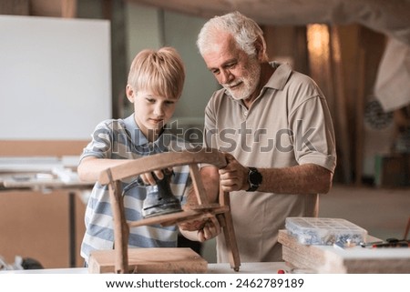 Similar – Image, Stock Photo Senior male woodworker working in garage
