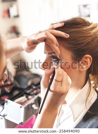Make-up artist work in her studio.