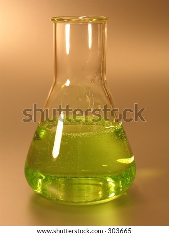 A conical (Erlenmeyer) flask with green liquid.