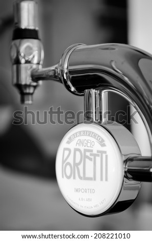 LEEDS - JULY 28: Poretti draft Italian beer pump, processed in black and white . July 28, 2014 in Leeds, UK.