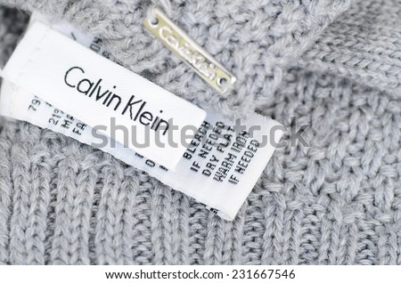 LONDON - NOVEMBER 16: Calvin Klein care label on a grey woolen garment. November 16, 2014 in London, UK.