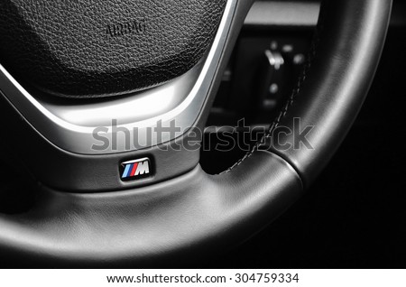 LONDON - AUGUST 10: BMW M Sport badge on the steering wheel. August 10, 2015 in London, UK.