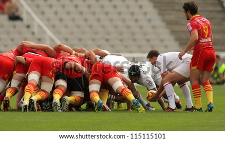 BARCELONA - SEPT 15: USAP Perpignan players scrumming during the French rugby union league match USAP Perpignan vs Stade Toulousain at the Olympic Stadium in Barcelona, on September 15, 2012