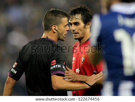 BARCELONA - NOV,10: Alejandro Arribas discussed with the referee Gil Manzano during the a League match between Espanyol and Osasuna at the Estadi Cornella on November 10, 2012 in Barcelona, Spain