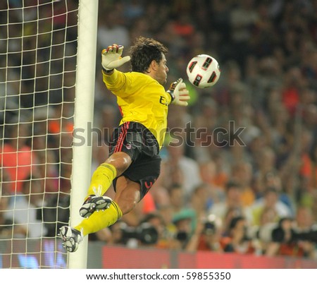BARCELONA - AUGUST 25: Flavio Roma of AC Milan in action during Trophy Joan Gamper match between FC Barcelona and AC Milan at Nou Camp Stadium on August 25, 2010 in Barcelona, Spain.