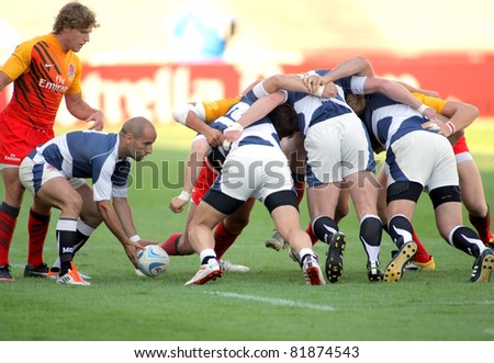 BARCELONA - JULY 9: Irakli Gvinjilia of Georgia throws the ball to the scrum during the match of Rugby7 European Championship against England at the Olympic Stadium in Barcelona, on July 9, 2011