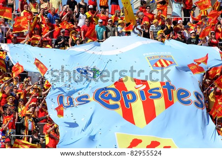 BARCELONA - APRIL, 9: USAP Perpignan\'s supporters during the Heineken European Cup quarter-final match USAP Perpignan against RC Toulon at the Olympic Stadium in Barcelona, Spain on April 9, 2011