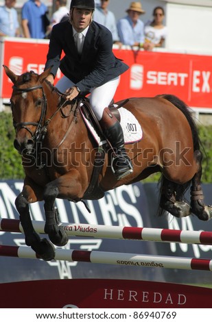 BARCELONA, SPAIN - SEPT, 23: Eugenio Corell in action rides horse Apolo 817 during the 100th CSIO event at the Real Club de Polo Barcelona on September 23, 2011 in Barcelona, Spain