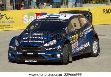 BARCELONA - OCT, 23: Miko Hirvonen of Finland and Jarmo Lehtinen of Finland in their FORD Fiesta RS during the Rally Catalunya-Costa Daurada  Spain on October 23, 2014 in Barcelona, Spainof the WRC