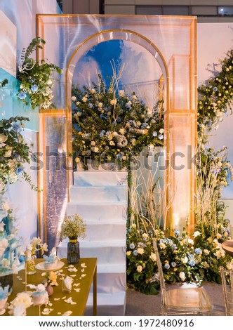 Wedding archway with flowers arranged for a wedding ceremony