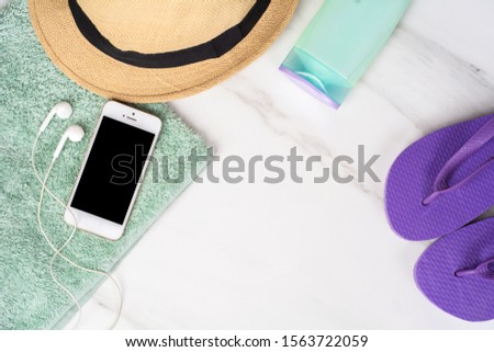 Similar – Foto Bild Smartphone, Flip-Flops, Sonnencreme und Handtuch.