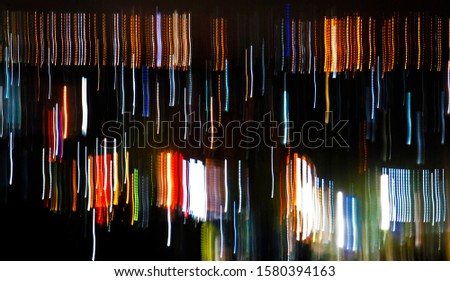 Defocused moving colorful lights background                               