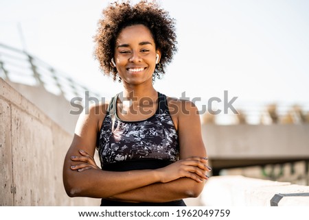 Similar – Image, Stock Photo Afro athlete woman standing outdoors.