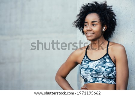 Similar – Image, Stock Photo Afro athlete woman standing outdoors.