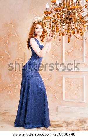 Queen, royal person with crown, red hair and violet, blue dress. Chandelier