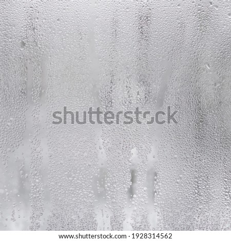 Wet window glass. Vector background image with drops. View from home on a rainy day.