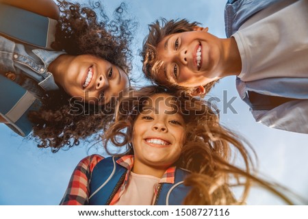 Similar – Image, Stock Photo Cute kid smiling at sunset with the sea in the background