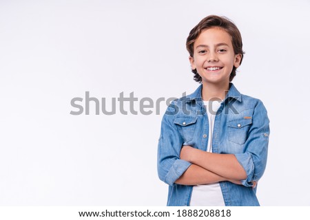 Image, Stock Photo little boy stands at the fence in front of two curious and hungry goats and shows his empty hands