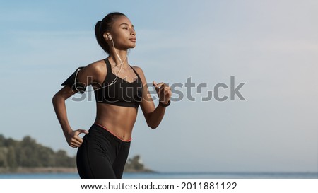 Similar – Image, Stock Photo young fit woman running away doing sport on a path in park