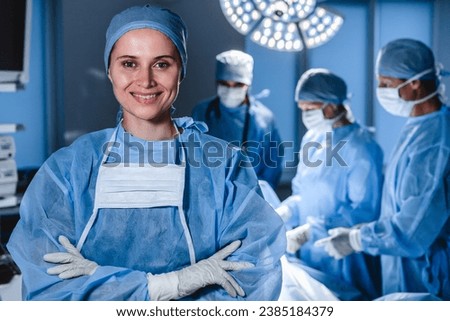 Similar – Image, Stock Photo Medical staff performing surgery in modern clinic