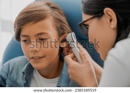Similar – Image, Stock Photo Nurse examining little boy in clinic