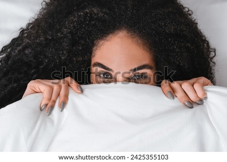 Image, Stock Photo Positive lady hiding under blanket at home