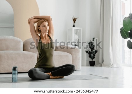 Similar – Image, Stock Photo Young woman doing stretching exercises on nature in mountains. Sports girl practicing yoga pose in leggings. beautiful forest landscape