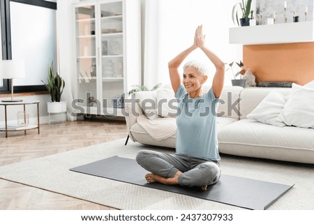 Similar – Image, Stock Photo Middle aged woman doing exercise on the beach