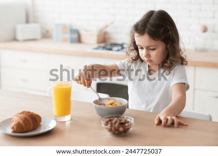 Image, Stock Photo Small Caucasian Girl Holding Sign and Pencil in Home Kitchen