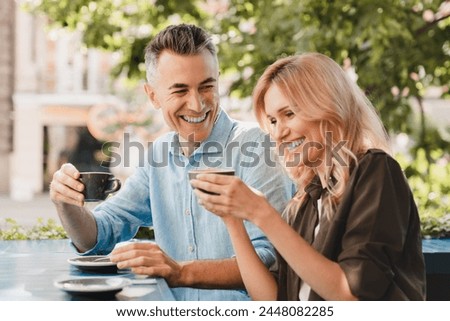 Similar – Image, Stock Photo Happy couple colleagues hugging on the street