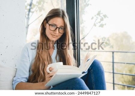 Similar – Image, Stock Photo balcony Reading Literature