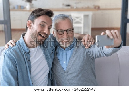 Similar – Image, Stock Photo Father with his young child in the home kitchen