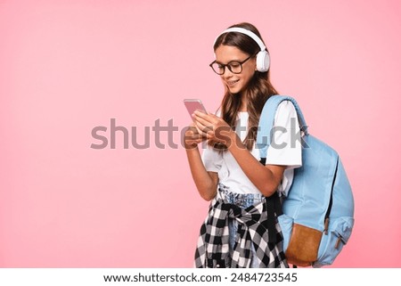 Similar – Image, Stock Photo Crop woman with headphones chatting on smartphone in evening town