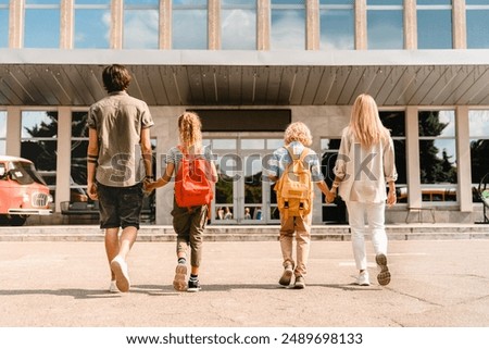 Similar – Image, Stock Photo Parent and children walking in the forest