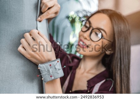 Similar – Image, Stock Photo Female tailor drawing cutout in workshop