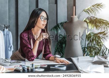 Similar – Image, Stock Photo Female tailor drawing cutout in workshop