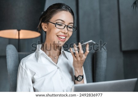 Similar – Image, Stock Photo Businesswoman having smartphone conversation near gray wall