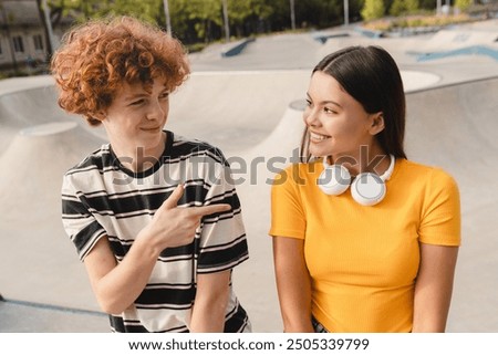 Similar – Image, Stock Photo Hipster teenage couple bonding on field in sunlight