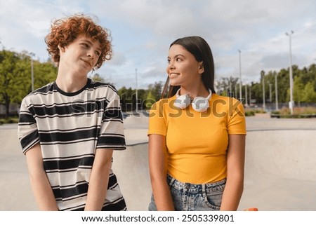 Similar – Image, Stock Photo Hipster teenage couple bonding on field in sunlight