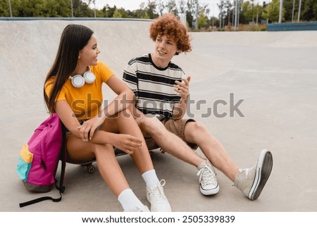 Image, Stock Photo Hipster teenage couple bonding on field in sunlight