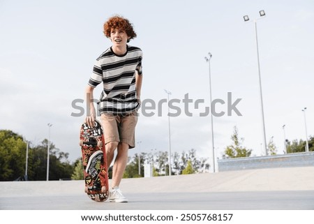 Similar – Foto Bild Männlicher Skateboarder fährt auf einer Böschung in einer tropischen Stadt