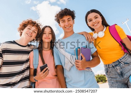 Similar – Image, Stock Photo friendly boy stands on a meadow and looks for floating autumn leaves