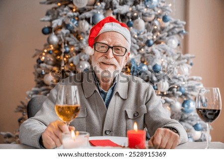 Similar – Foto Bild Älterer Mann öffnet Champagnerflasche während der Weihnachtsfeier zu Hause