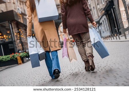 Similar – Foto Bild Crop Frau mit Einkaufstaschen auf der Straße