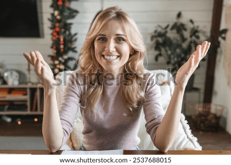 Similar – Image, Stock Photo Young woman making video call sending greetings from vacation trip in mountains. Woman with backpack hiking through tall grass along path on meadow