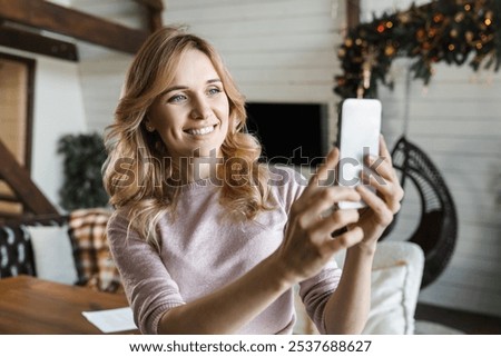 Similar – Image, Stock Photo Cheerful woman taking selfie on smartphone in city