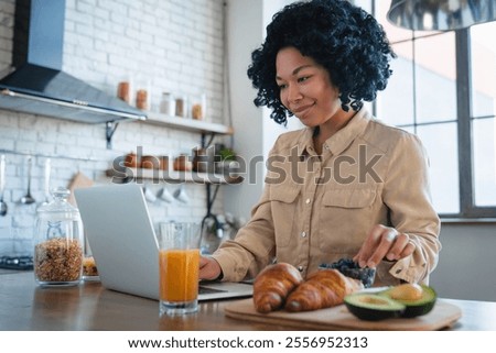 Similar – Image, Stock Photo Woman browsing laptop during online shopping at home