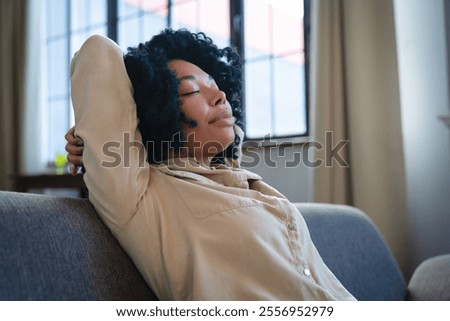 Similar – Image, Stock Photo Content young black lady reading notes while lying on bed