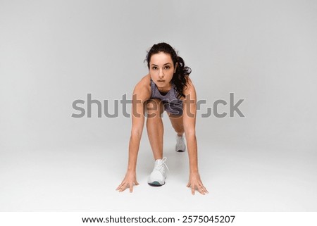 Similar – Image, Stock Photo Strong sportswoman jumping over sandy hill